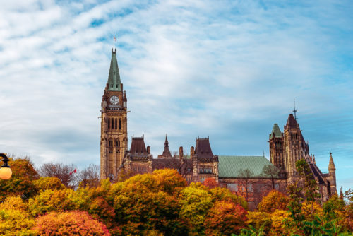 Wide Shot of Fall Foliage in Front of Canadian Parliament Buildi