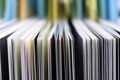 A close up of a stack of books.