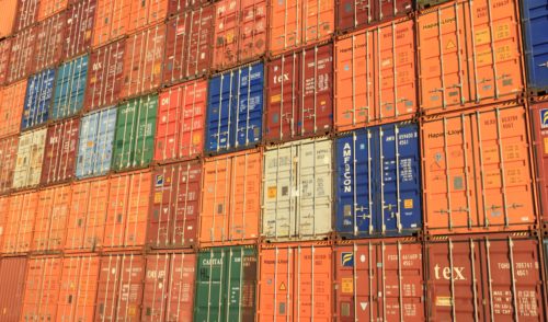 A large group of containers stacked on top of each other.